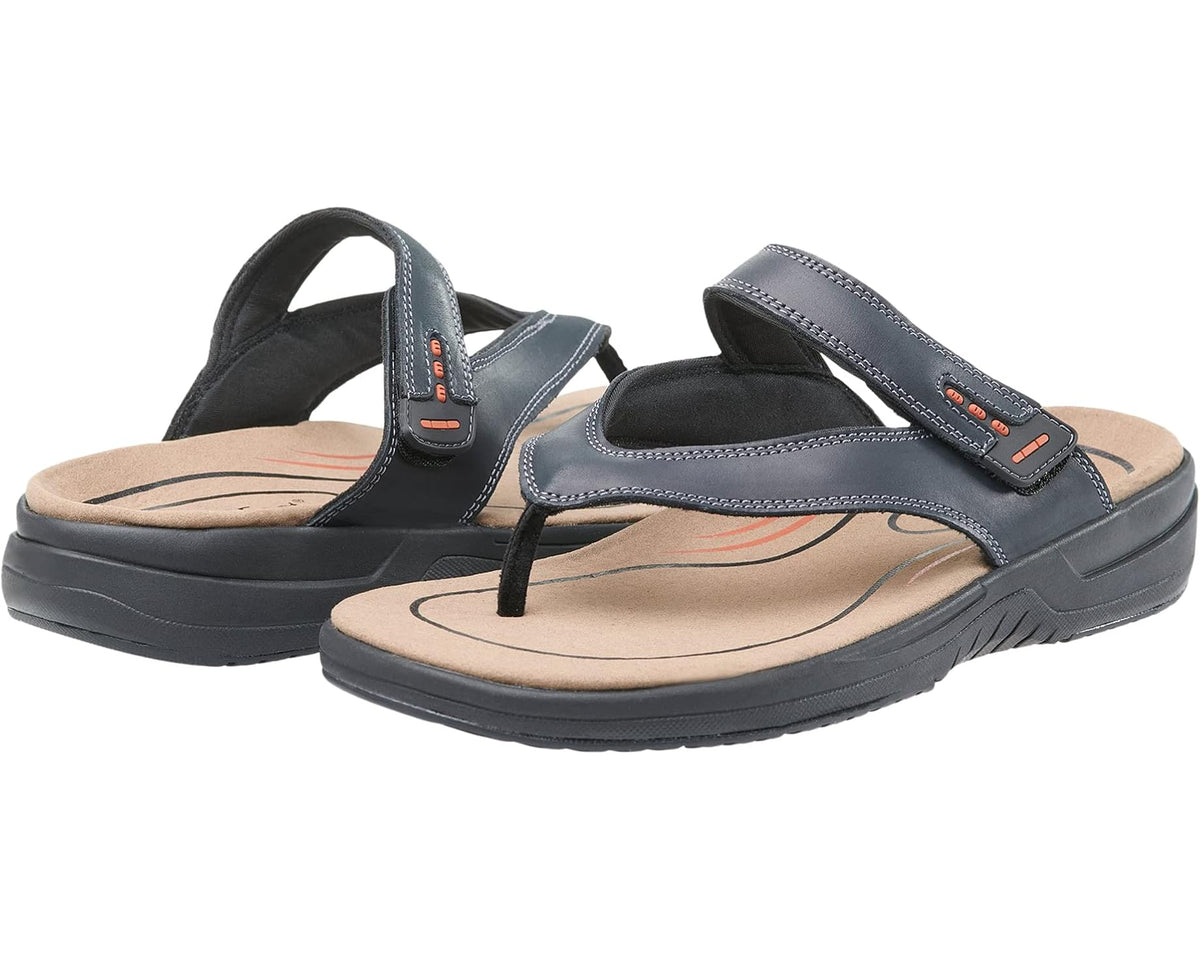 Black slide sandals with thong strap, cushioned sole, and orange stitching accents