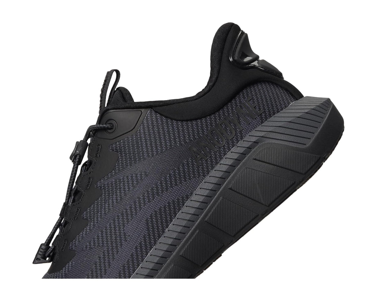 Anodyne men's black sport sneaker, side strap detail and ribbed midsole traction