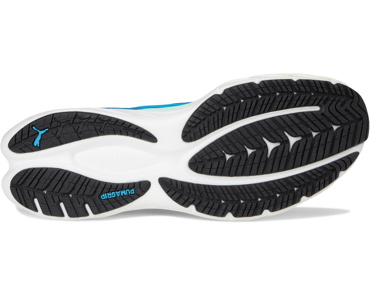 Blue and white running shoes outsole view with traction tread