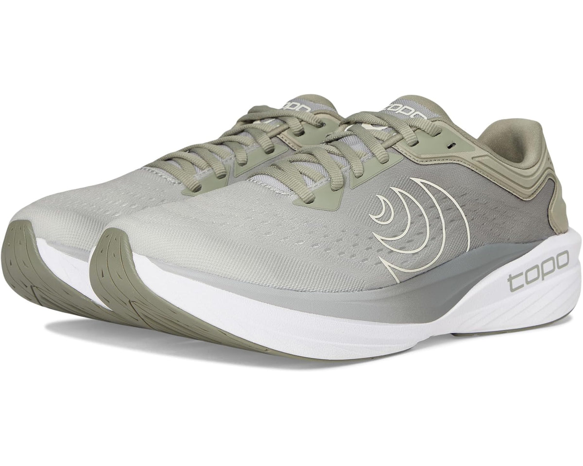 Topo men's running shoe in khaki and white, side profile with curved logo