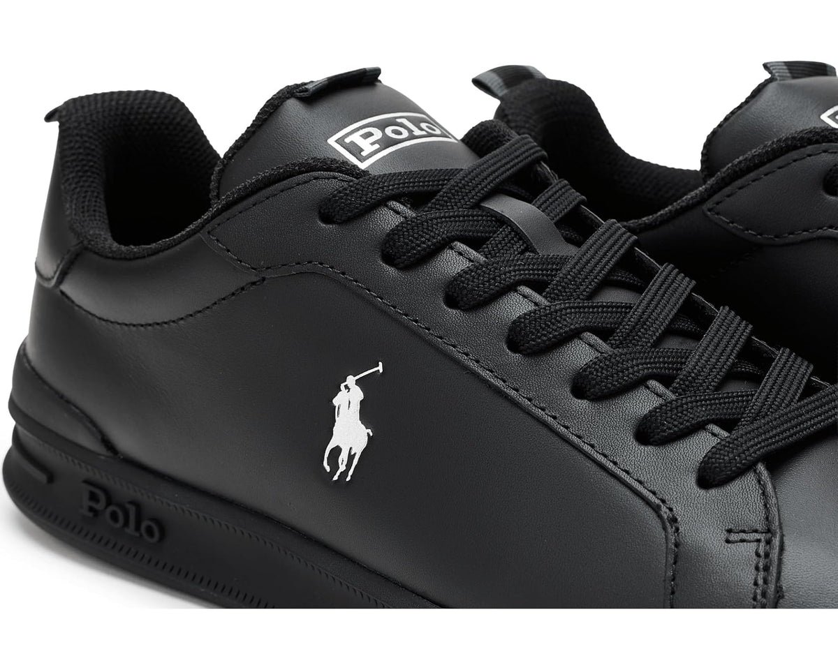 Black leather sneaker close-up with white Polo horse logo and black laces