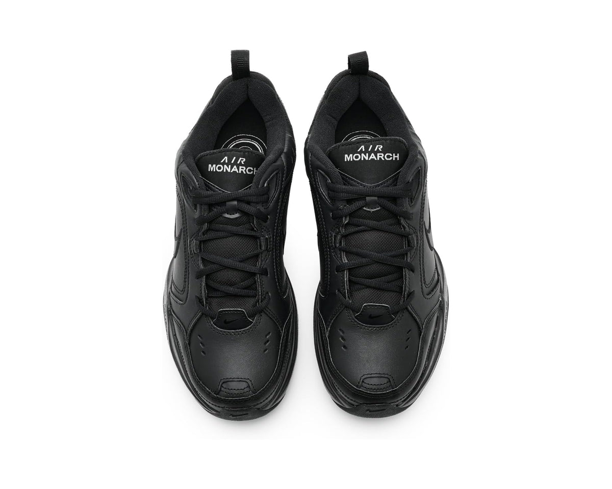 Black Nike sneakers shown from top view with Air Monarch heel text.