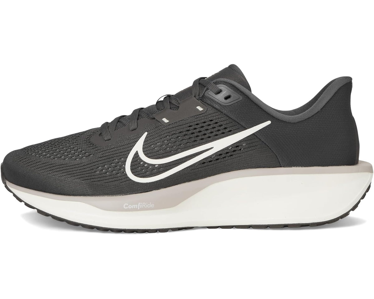 Men's black running shoes with white swoosh, foam midsole, lace-up.