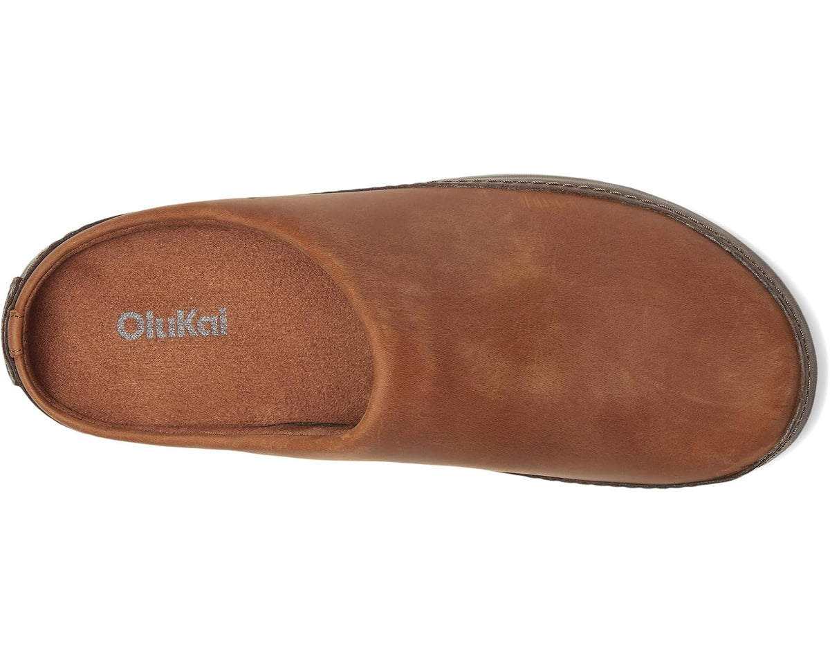 Suede slip-on clog with tan interior lining and OluKai logo on footbed
