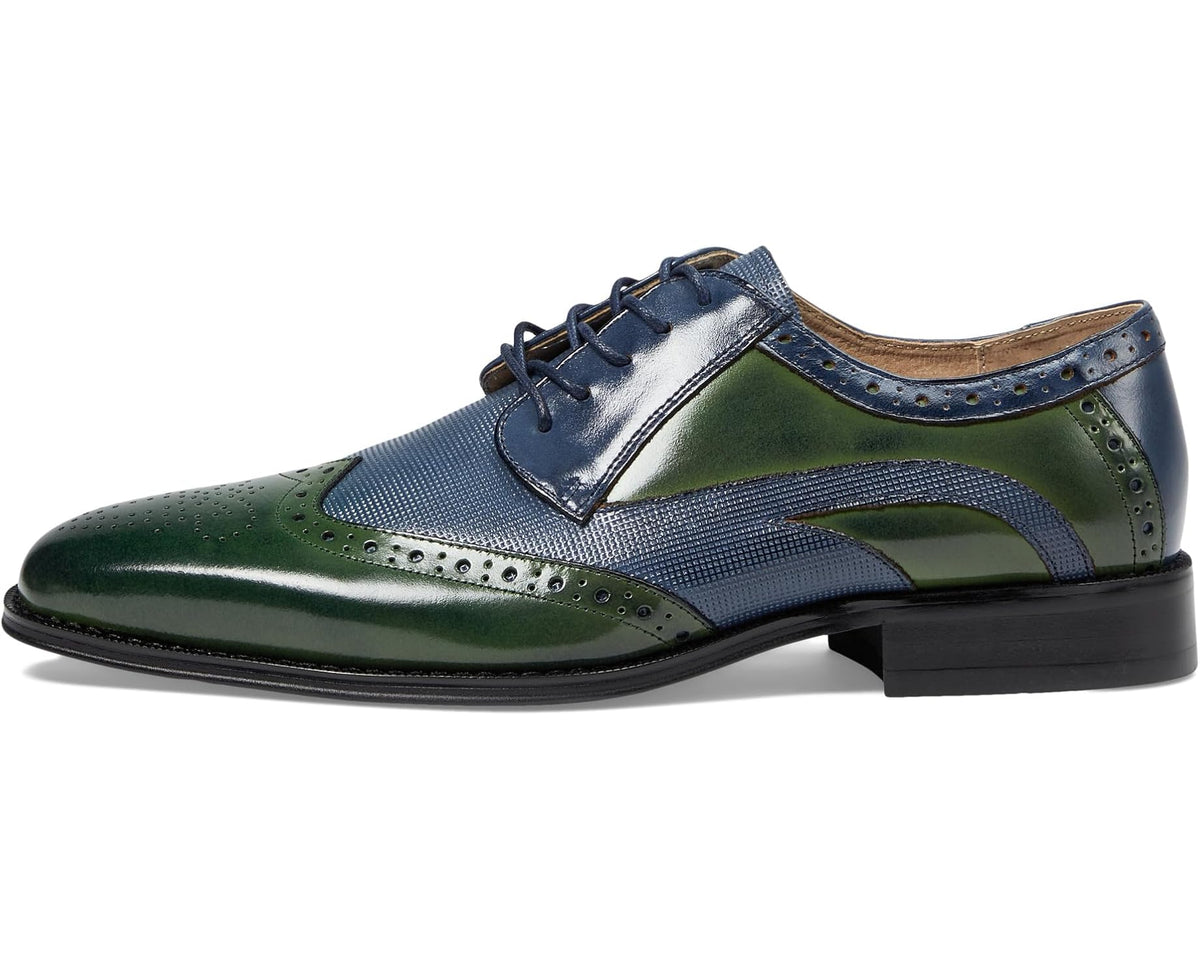 Men's lace-up dress shoe with navy and green panels, perforated wingtip and black sole