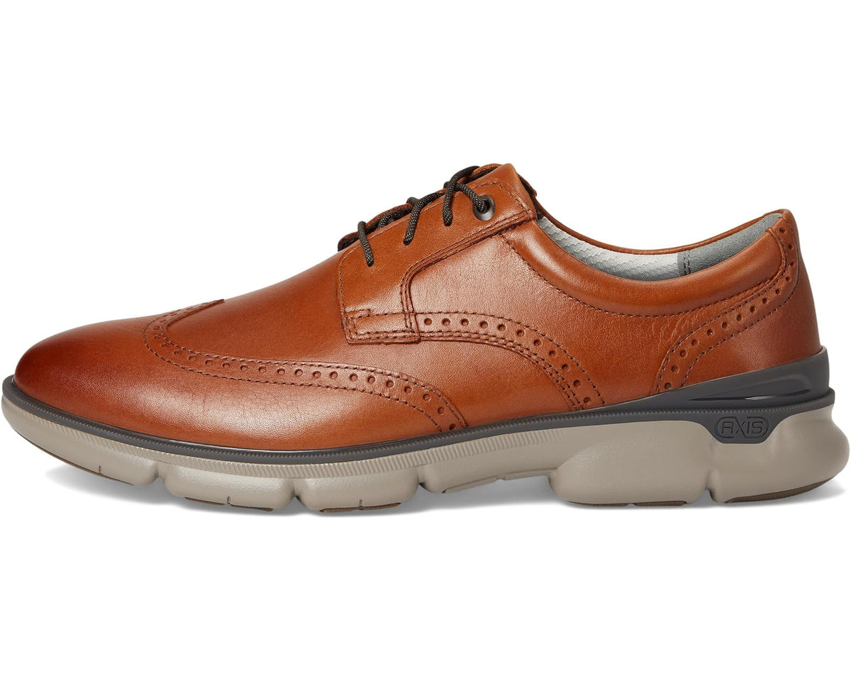 Tan leather lace-up oxford with wingtip stitching and padded collar lining