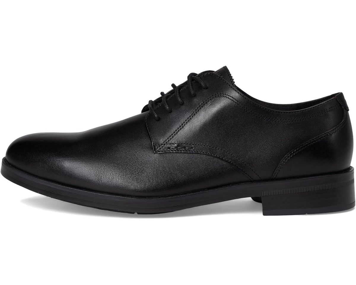 Black leather plain-toe oxford shoe with lace-up closure and low block heel