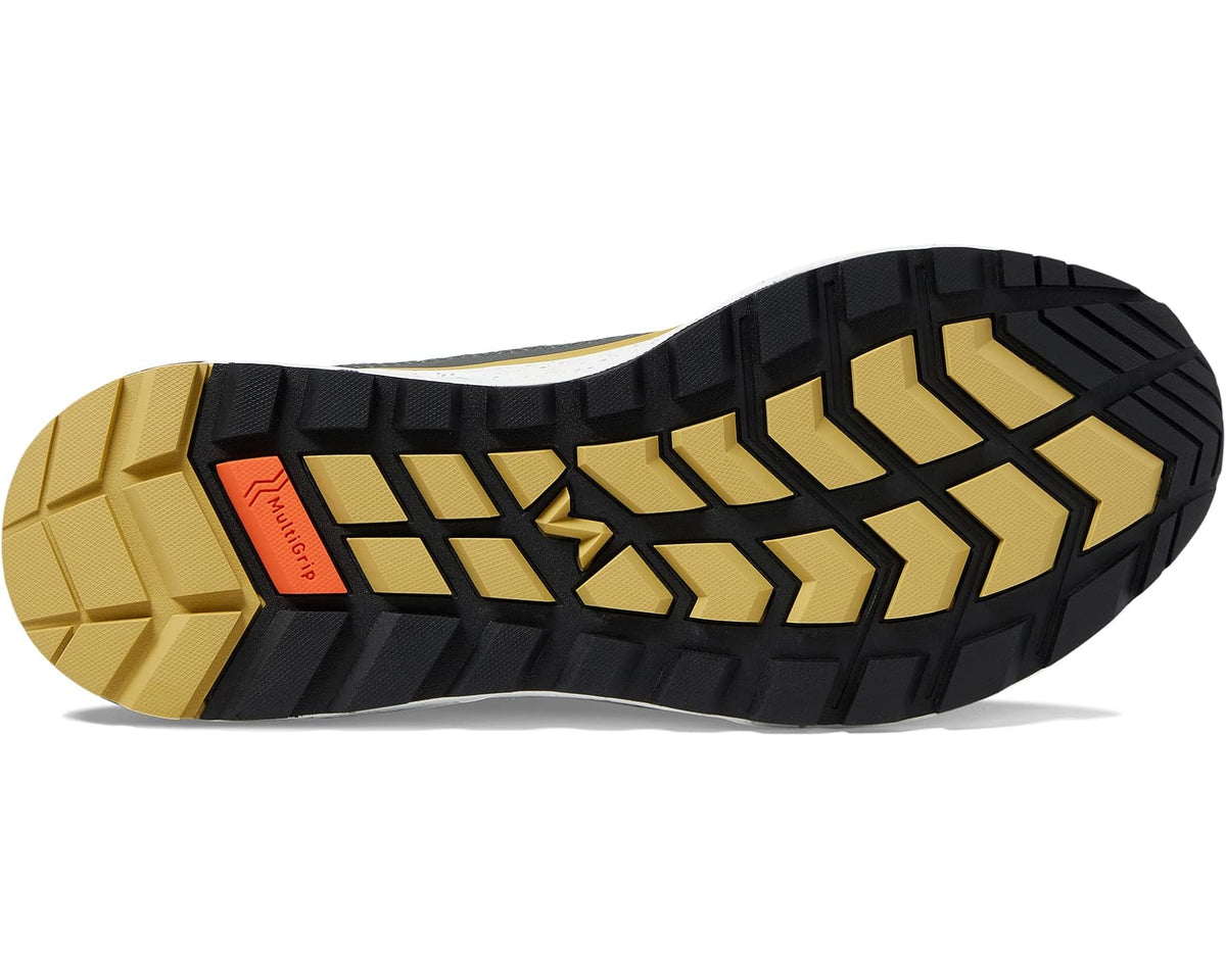 Rubber outsole for navy trail shoe with chunky tread and yellow accents