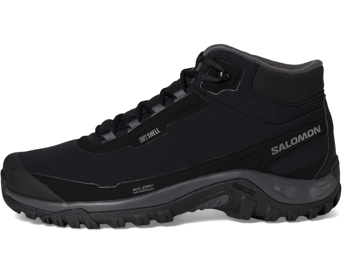 Black Salomon men's mid hiking boot with lace-up closure, pull tab, and toe cap