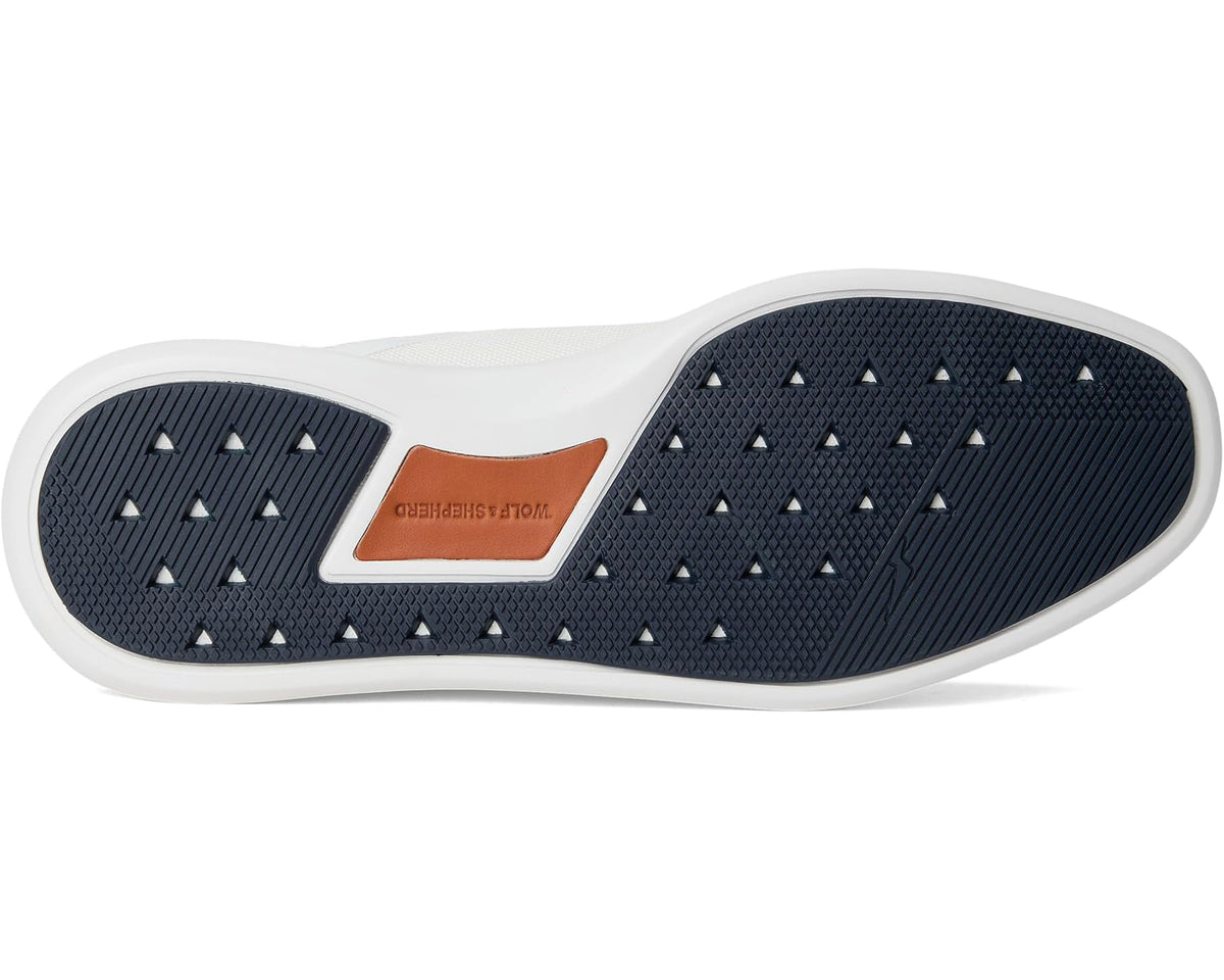 White sneaker outsole with dark blue tread pattern and textured grip