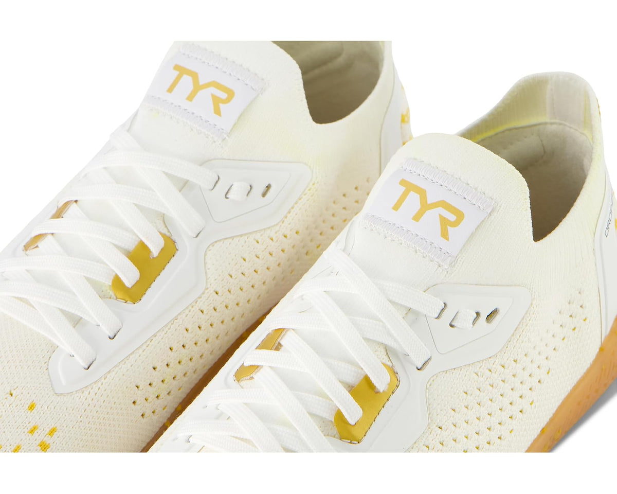 Men's TYR Dropzero sneakers, close-up; white laces and perforated knit with gold TR patch