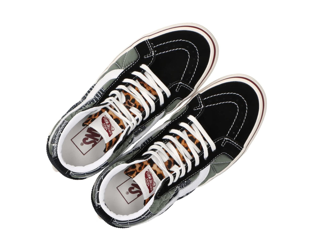 Black high-top sneakers with white laces, patterned side panels, and light-colored lining