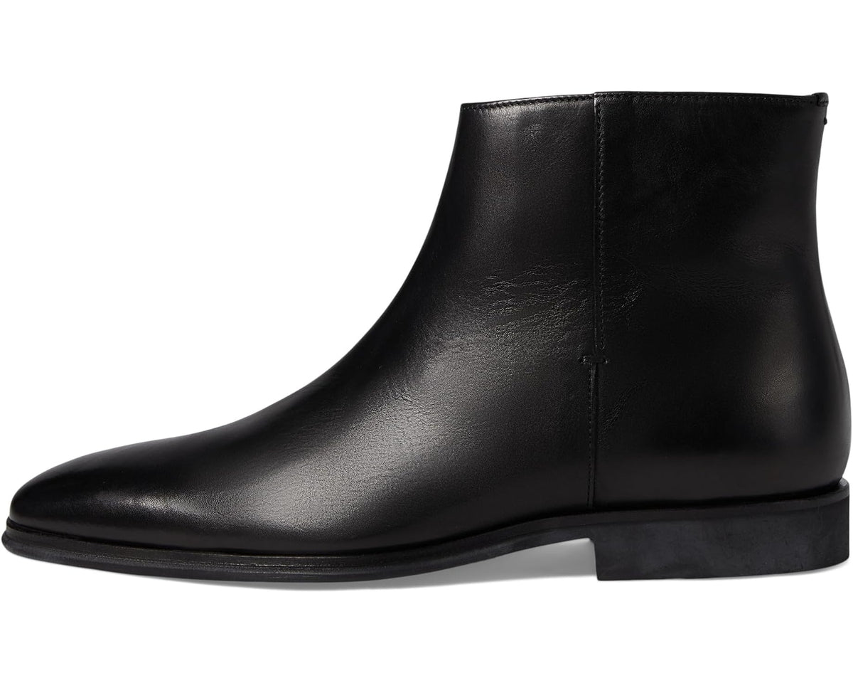 Black leather ankle boot with side seam and low stacked heel