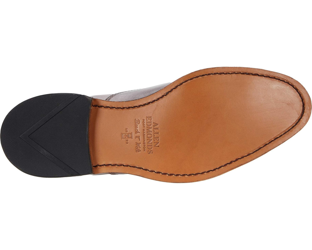 Allen Edmonds Park Avenue oxford outsole with dark rubber tread and tan stitched insole.