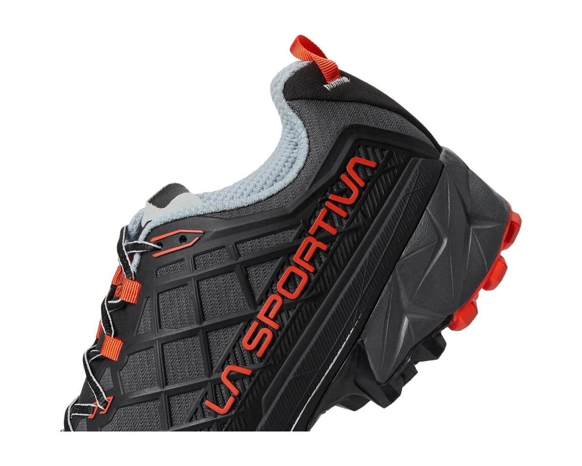 La Sportiva trail shoe quarter view, black tread-pattern upper with orange lace details