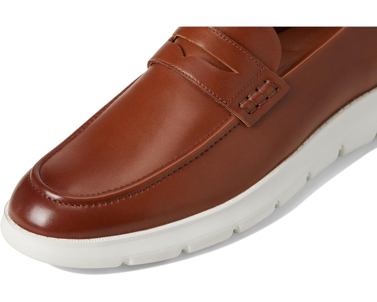 Cognac leather slip-on loafer with stitched strap across vamp and white sole