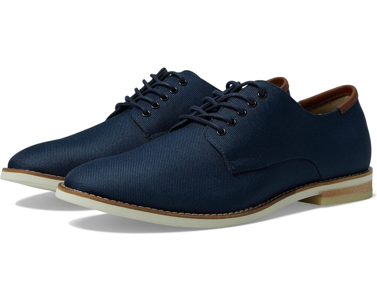 Men's navy lace-up oxford shoe with tan sole and brown heel trim