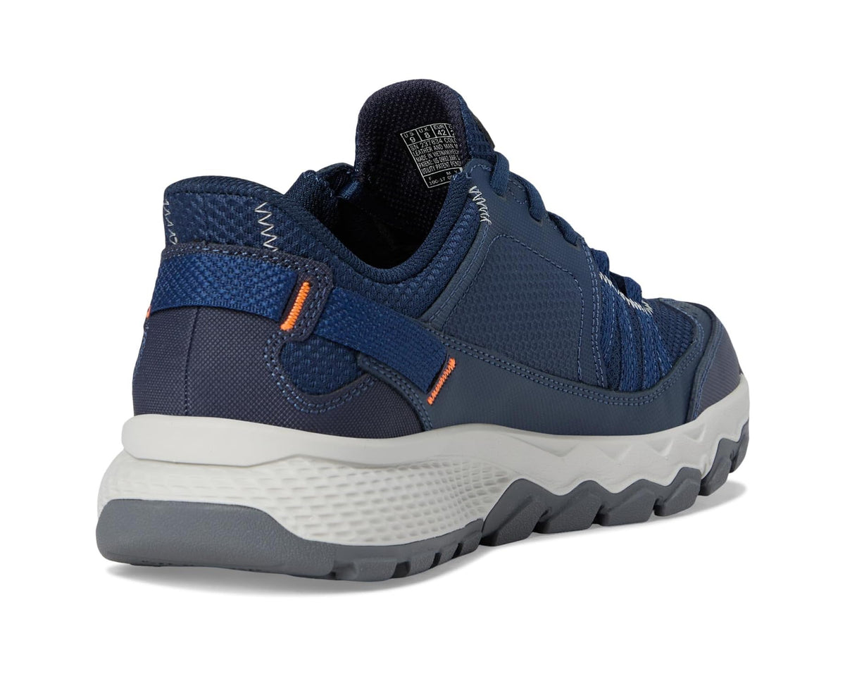 Navy slip-in sneaker heel with cushioned collar, orange detail, and white midsole