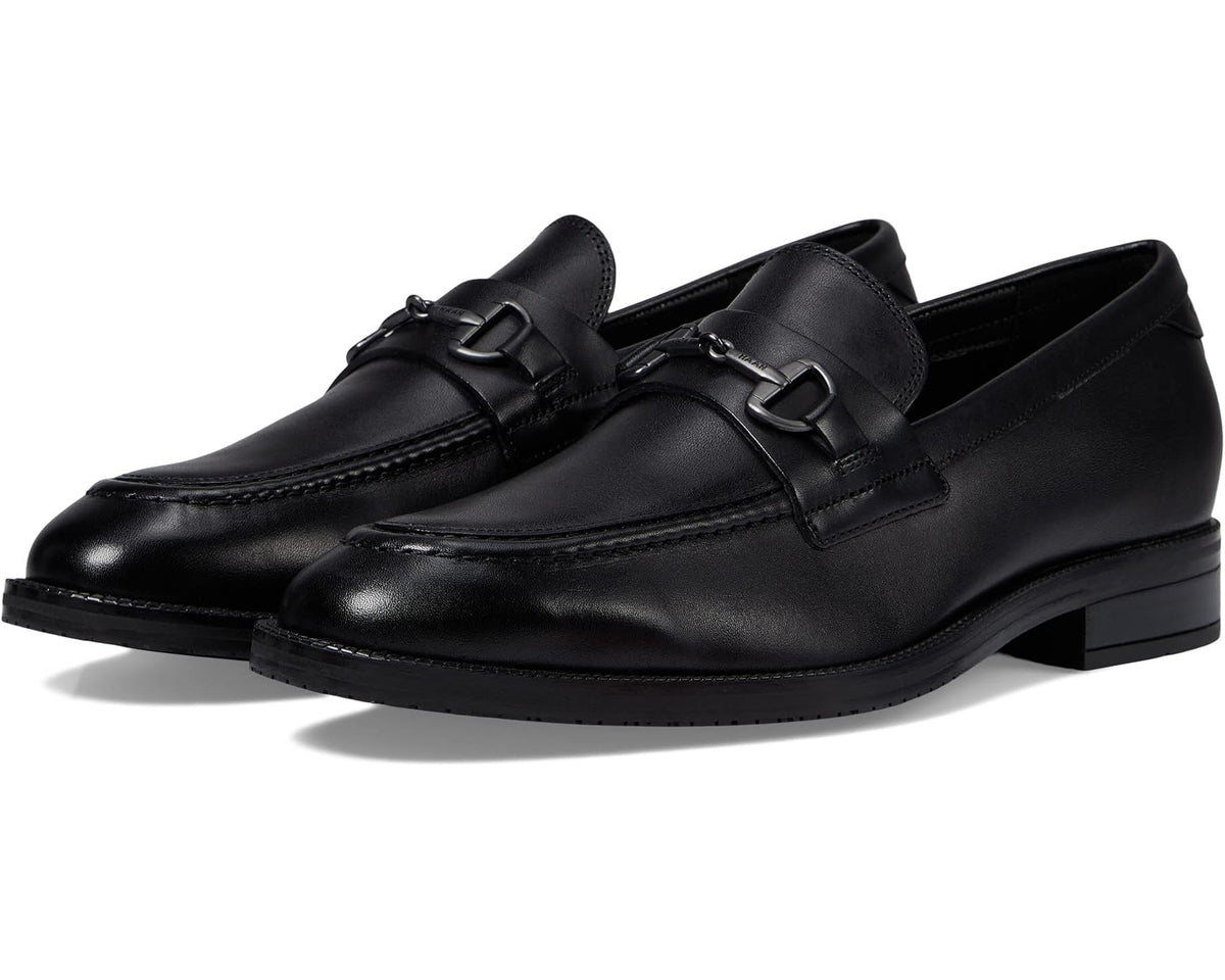 Black leather bit loafers with metal horsebit detail and stitched upper