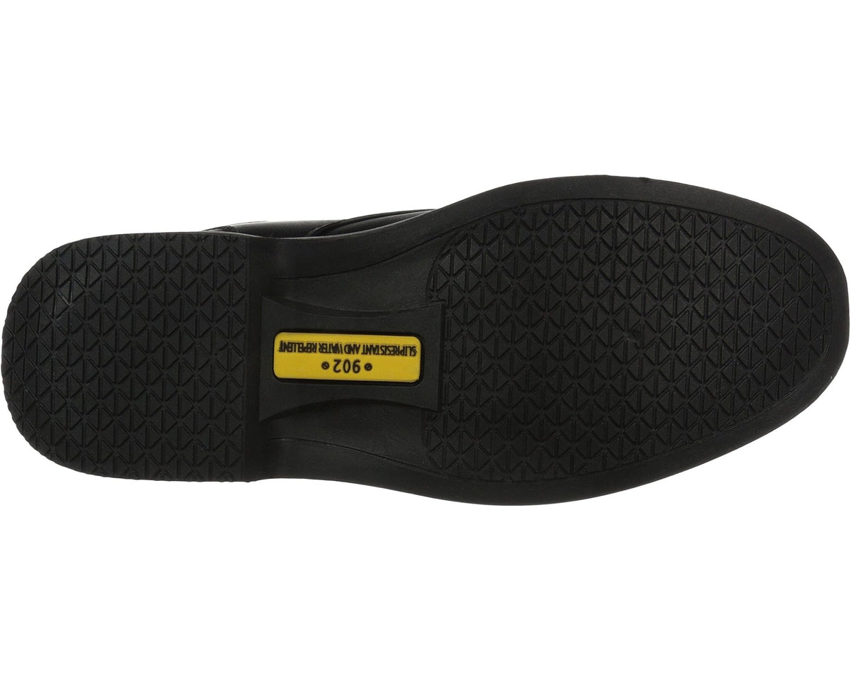 Men's black shoe outsole with textured tread and yellow logo label