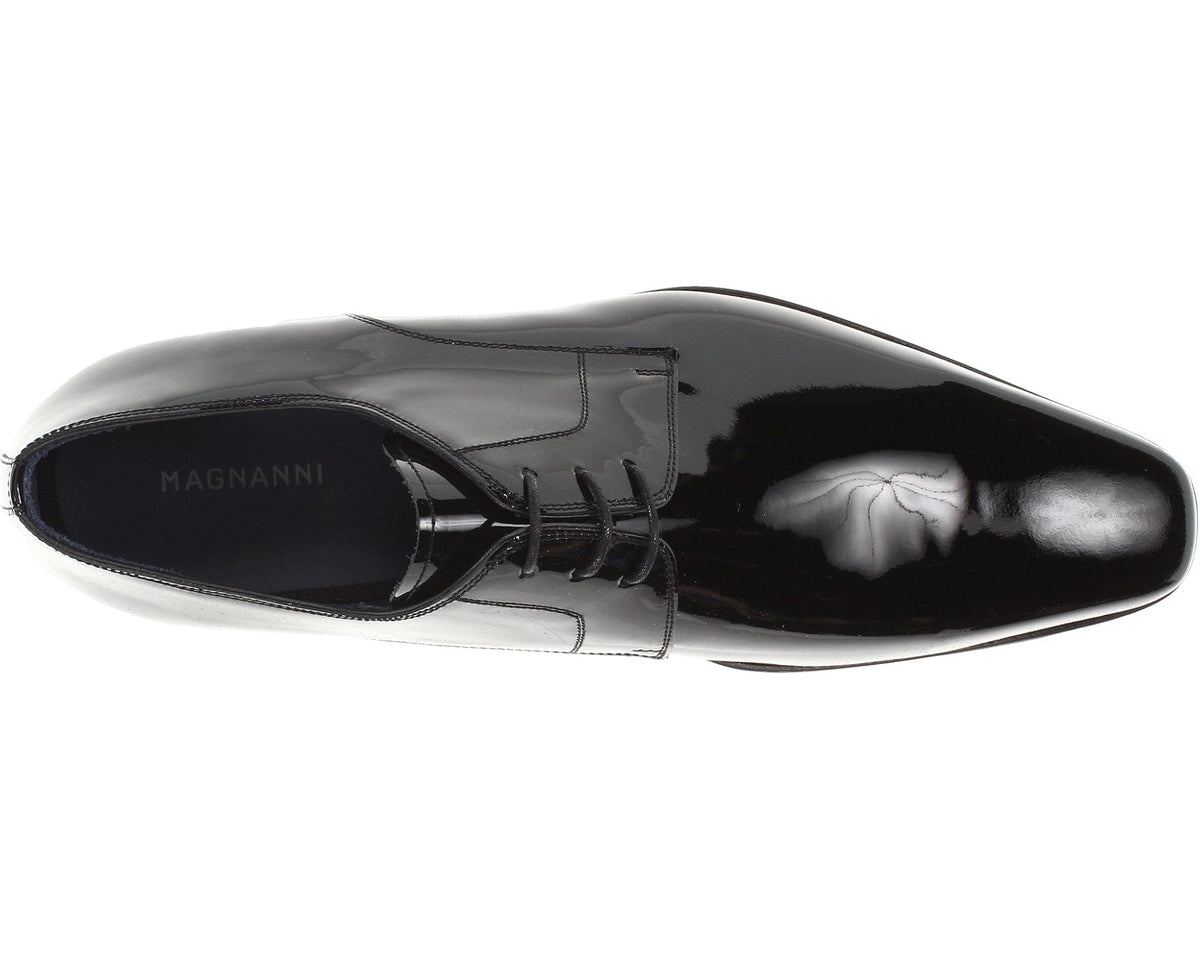 Men's black patent leather Oxford dress shoe, side view with lace and toe detail.
