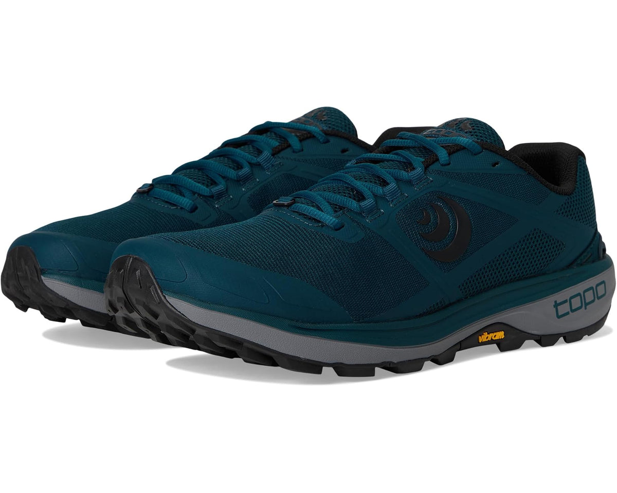 Men's trail running shoes in teal navy with black accents, lace-up design and rugged sole