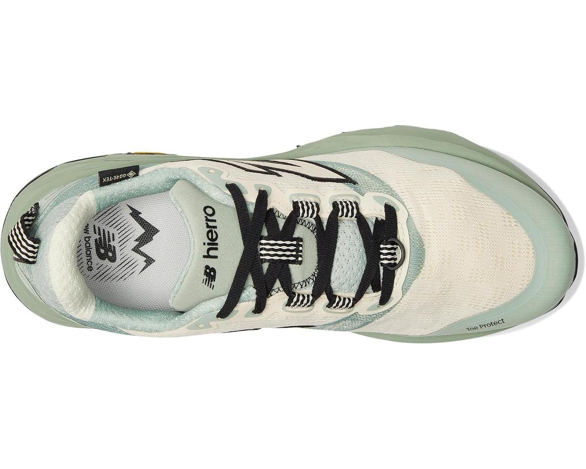 Men's New Balance trail shoes, side view with black laces and large N logo
