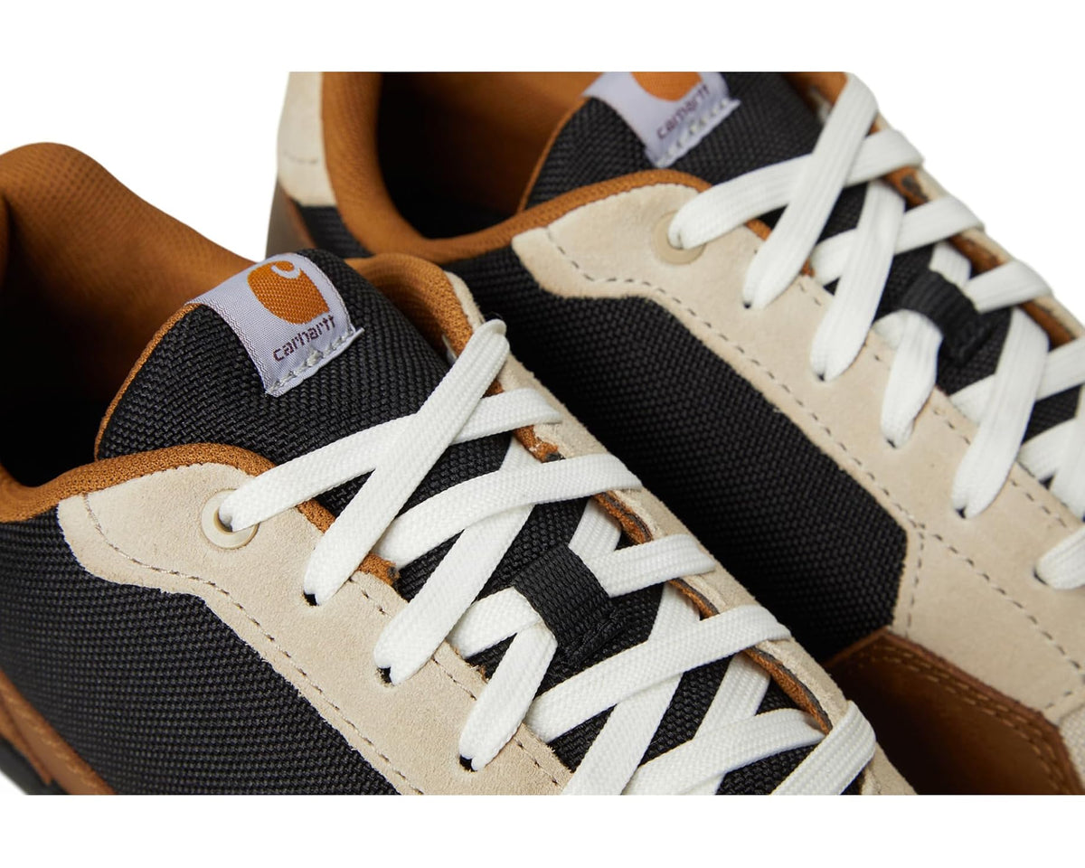 Carhartt Greenfield sneaker close-up: black and cream uppers with white laces