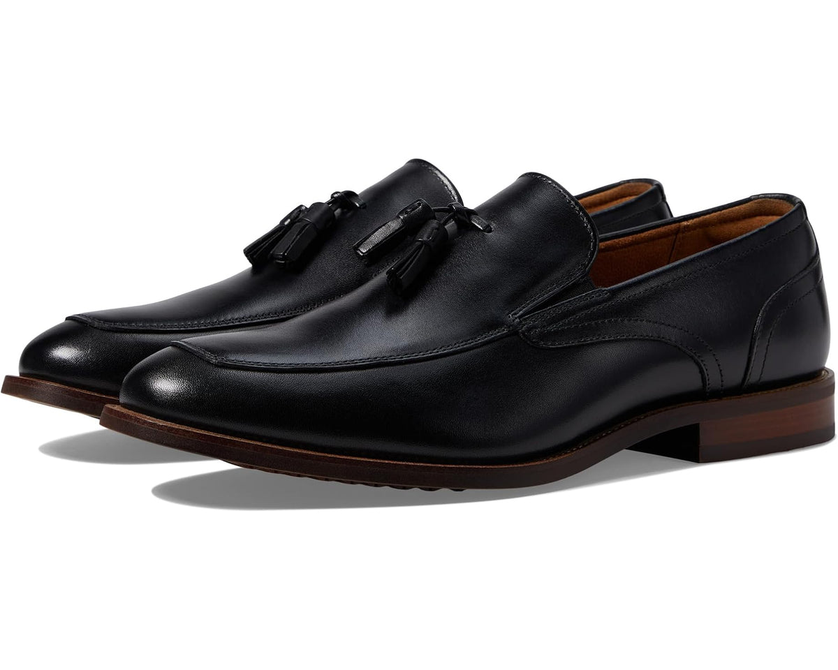 Men's black moc-toe tassel loafer with tassel vamp and side strap detail