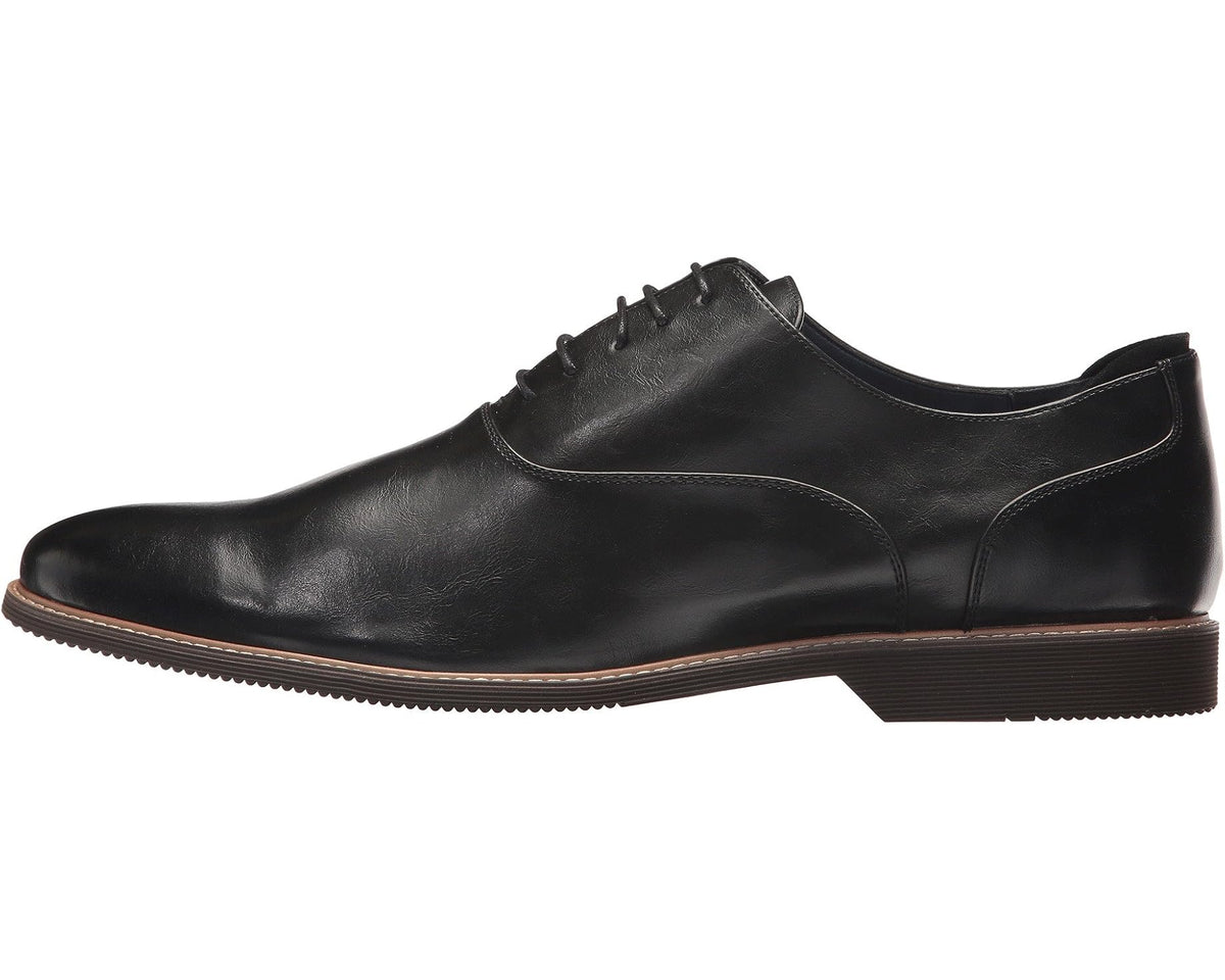 Black lace-up dress shoe with side seam and low profile sole