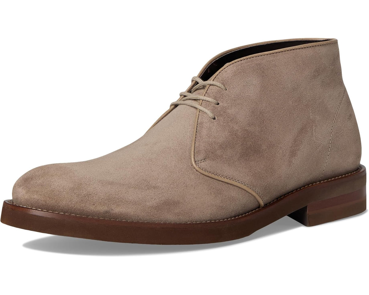 Front 3/4 view of slate-brown suede lace-up chukka boot with low heel