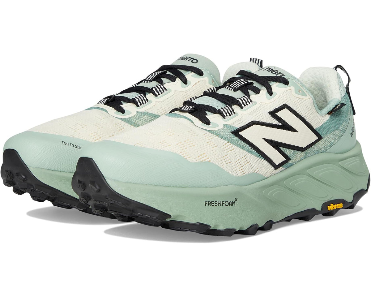 Men's New Balance trail shoes in mint, cream, and black with bold N logo and tread