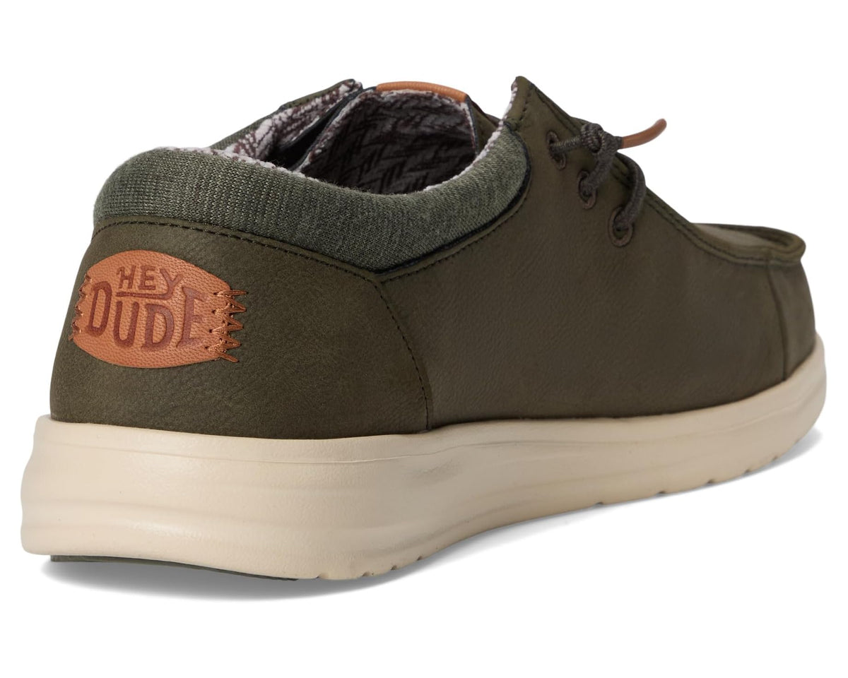 Olive casual shoes with padded lining, heel tab detail, and beige rubber sole