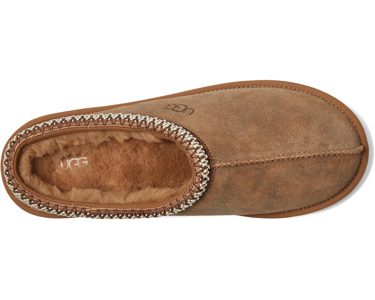 Chestnut suede slipper showing interior lining, stitched braided edge, and UGG logo