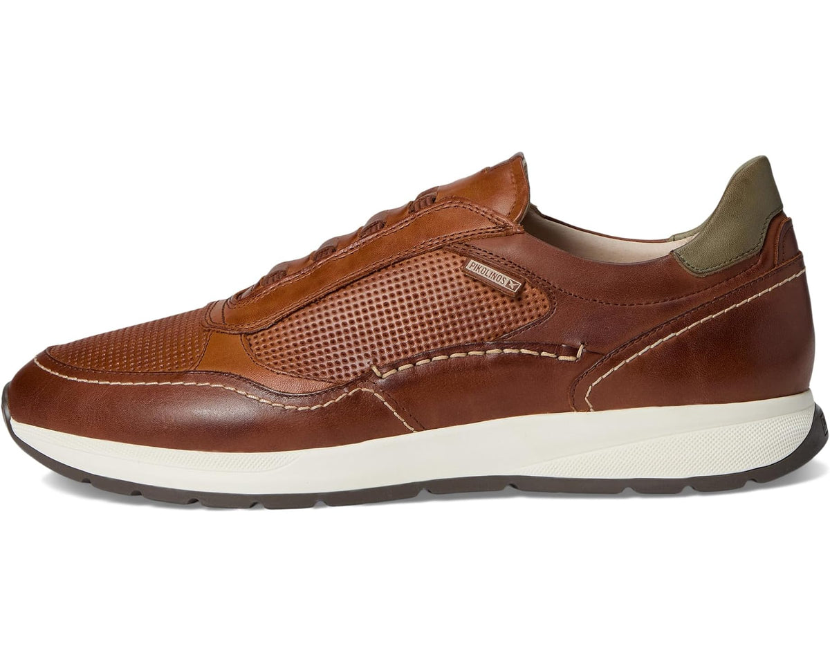 Brown leather low-top sneaker with perforated side panels and cushioned collar