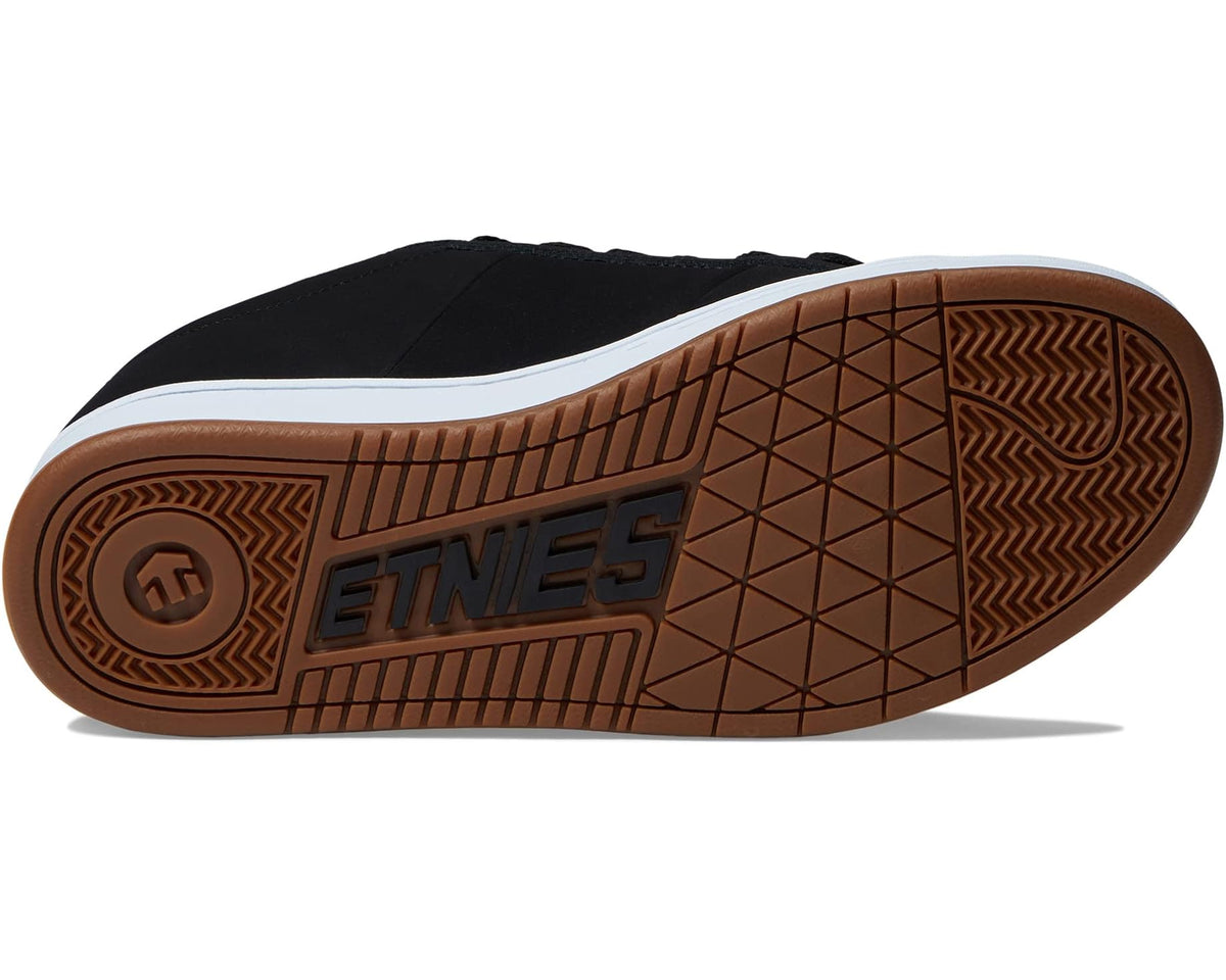 Black low-top sneaker with gum patterned outsole and white midsole.