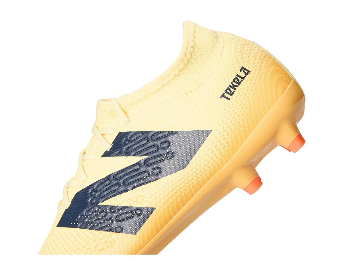 Light yellow soccer cleat upper with navy side panels and orange-stud sole
