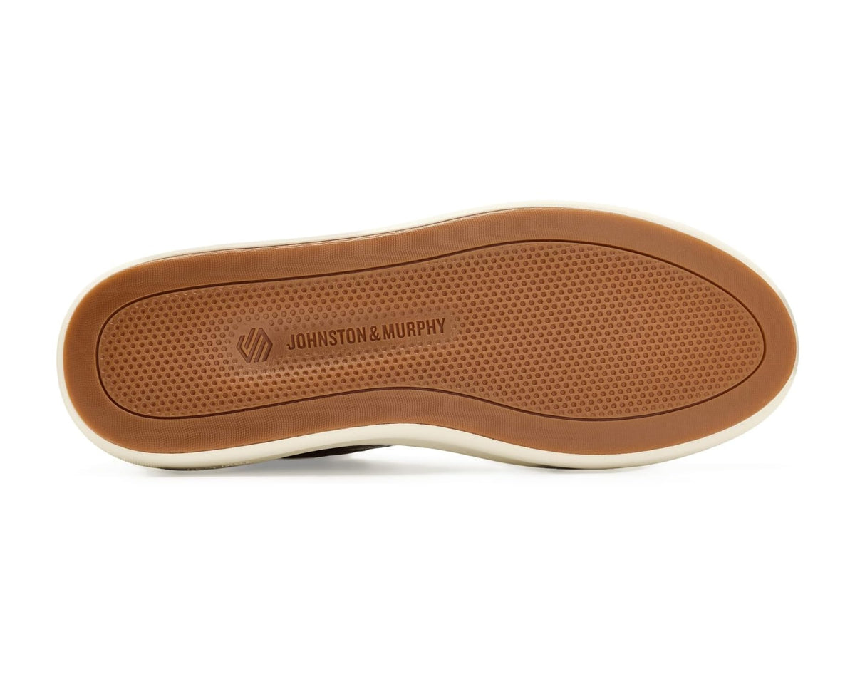Tan rubber outsole with tread pattern and Johnston & Murphy logo