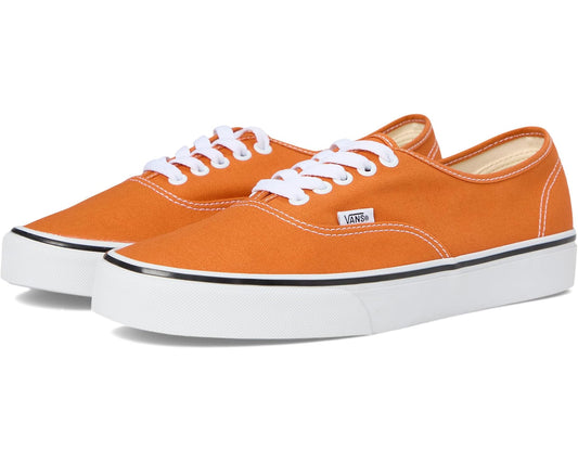 Orange canvas low-top sneakers with white laces and Vans side patch