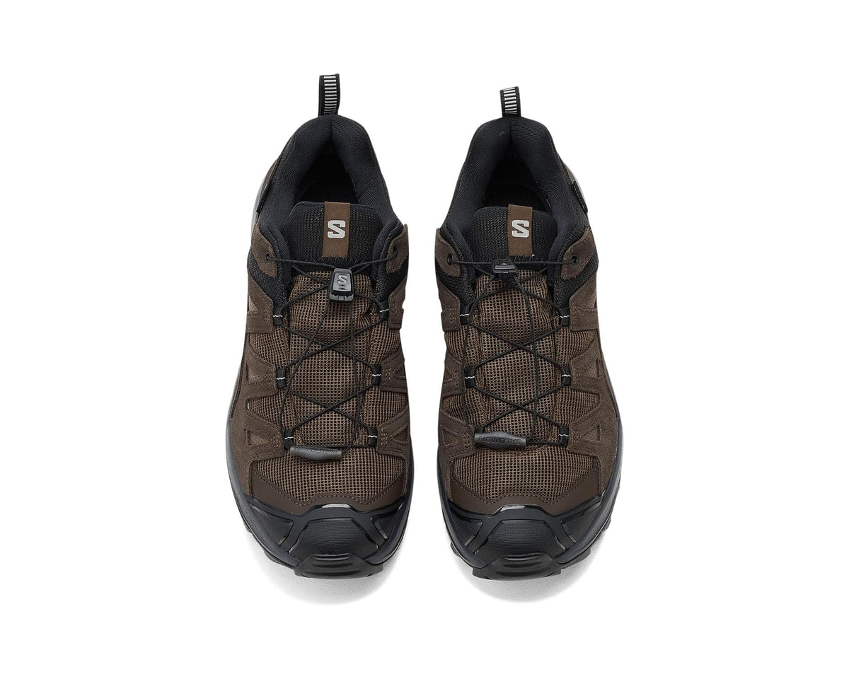 Men's Salomon mid-top hiking shoes, brown mesh uppers and black collar, lace-up