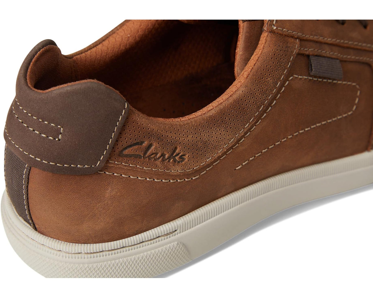 Brown suede sneaker back with Clarks logo embroidery and cushioned collar