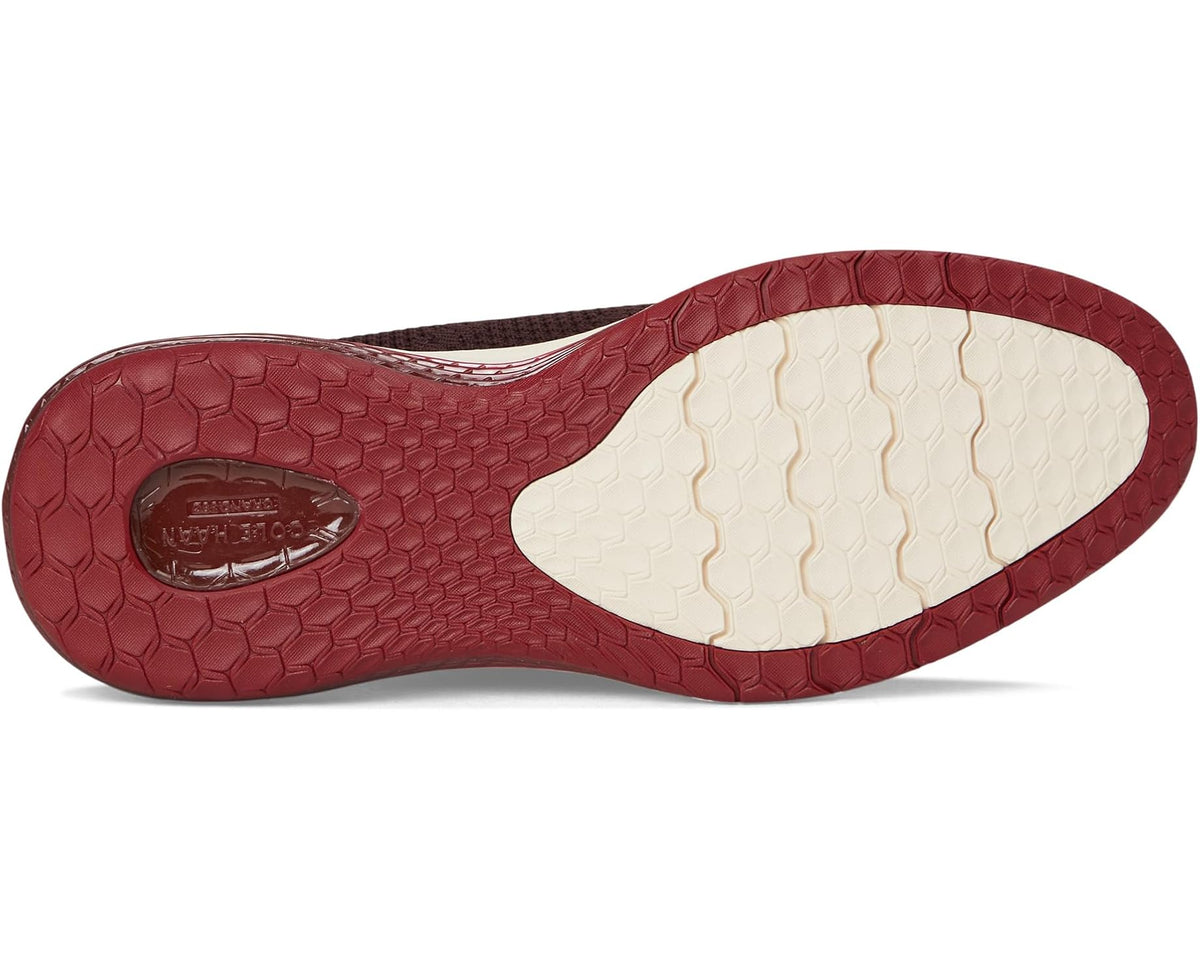 Men's oxford sneaker outsole with red textured tread and off-white inset on heel