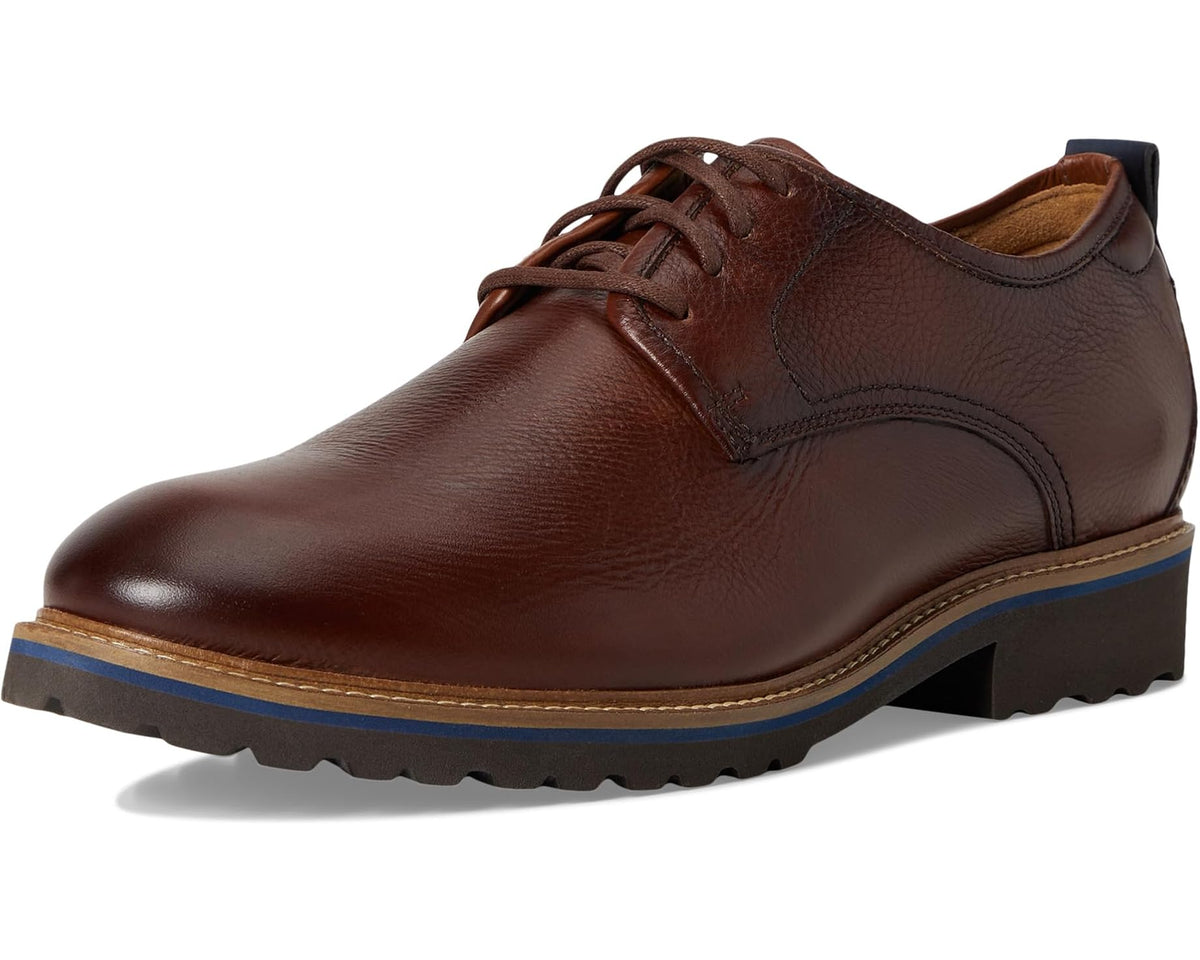 Brown leather lace-up oxford with rounded toe, seam accents, and treaded sole