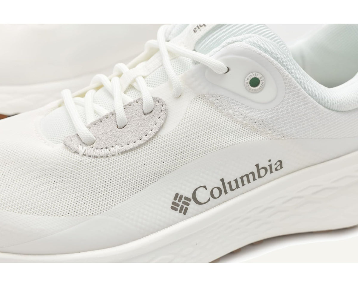 Close-up of white knit upper, laces, and Columbia logo on running shoe