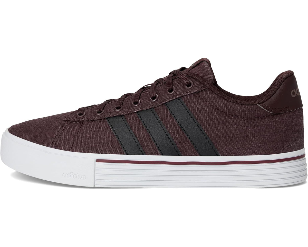 Unisex adidas lace-up sneakers with dark brown fabric, black stripes, and white platform sole