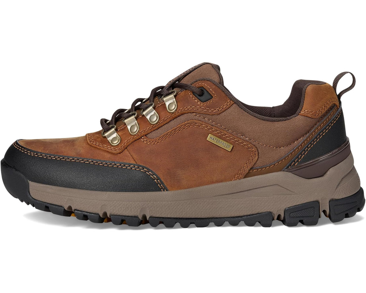 Brown lace-up boot with padded collar, stitched details, and rubber grip sole