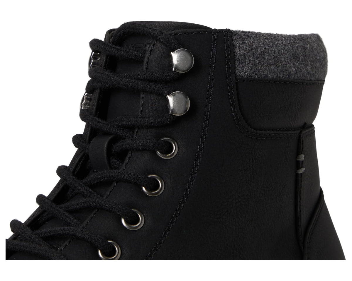 Black laced boot upper detail with metal eyelets, gray wool cuff, and side panel stitching