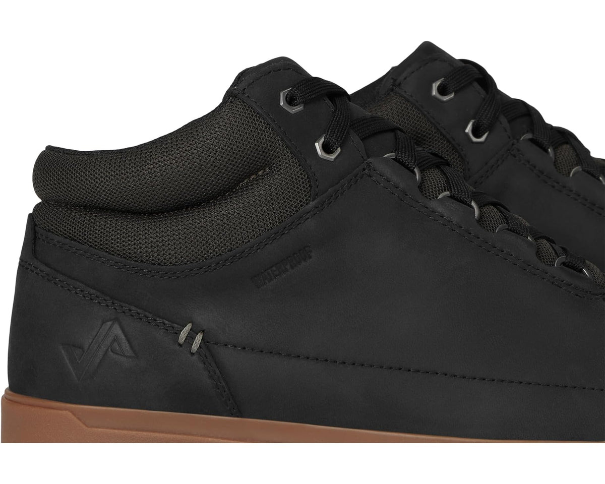 Black waterproof boot side close-up with mesh collar and lace-up panels