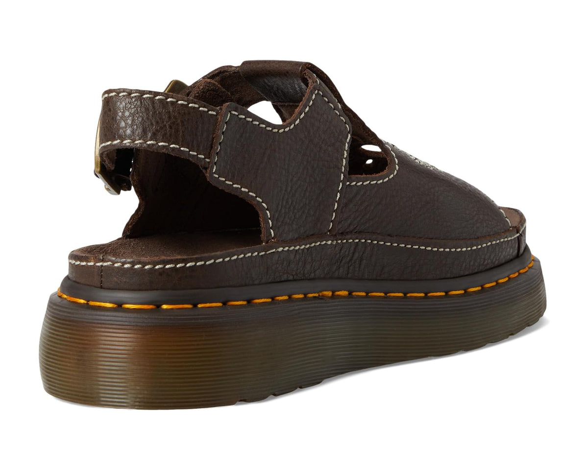 Brown leather sandal with thick sole, open toe strap, and stitched seams