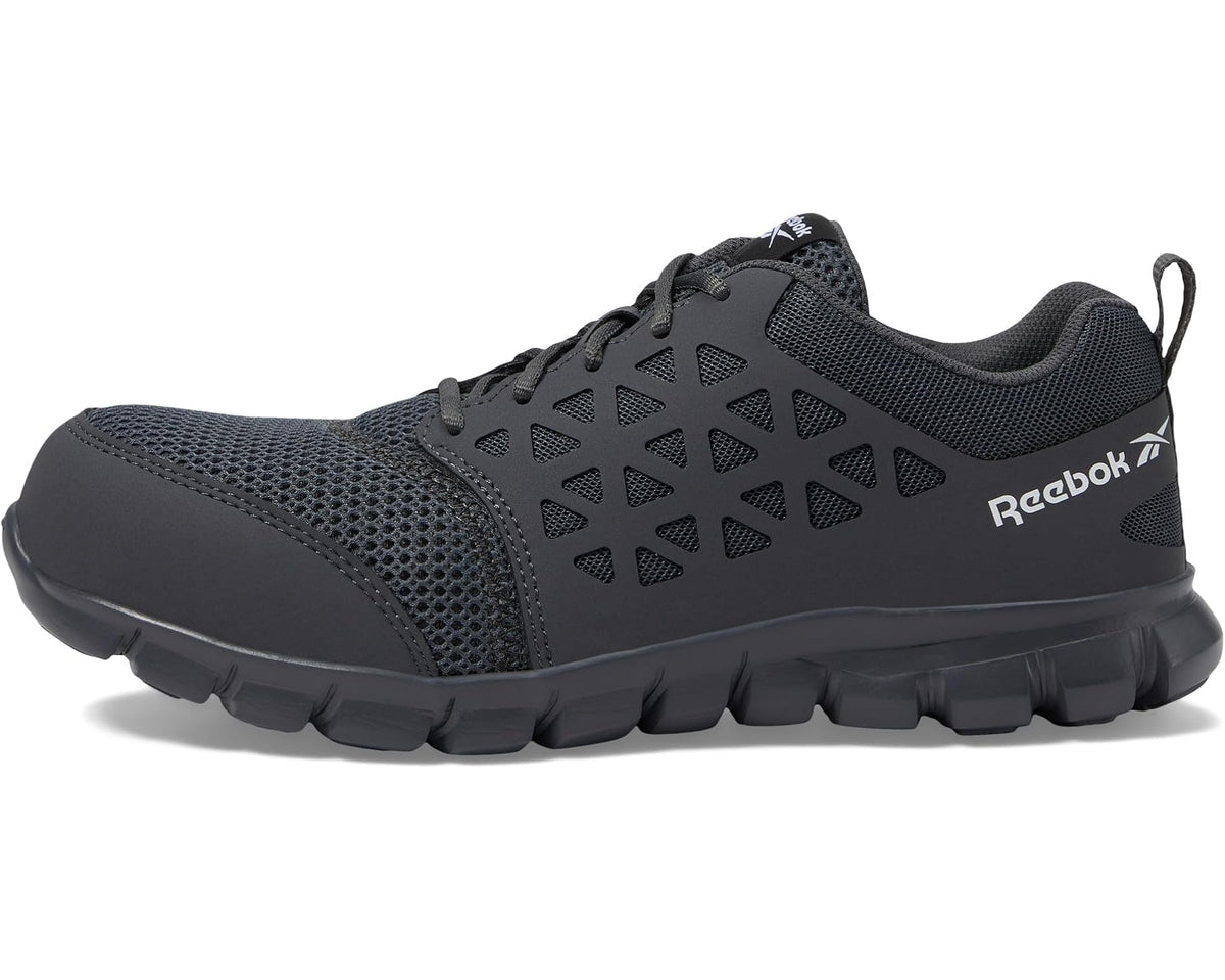 Grey lace-up work shoe with textured mesh upper and Reebok logo on side